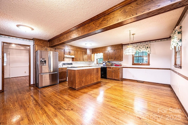 3781 Dover St, Claremont, NC 28610 - kitchen with stainless steel fridge with ice dispenser, a textured ceiling, wood finished floors, light countertops, and a center island