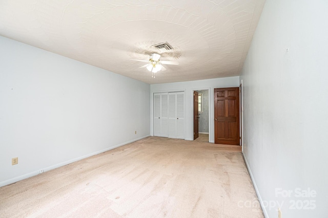 3781 Dover St, Claremont, NC 28610 - unfurnished bedroom with light carpet, a closet, and a ceiling fan
