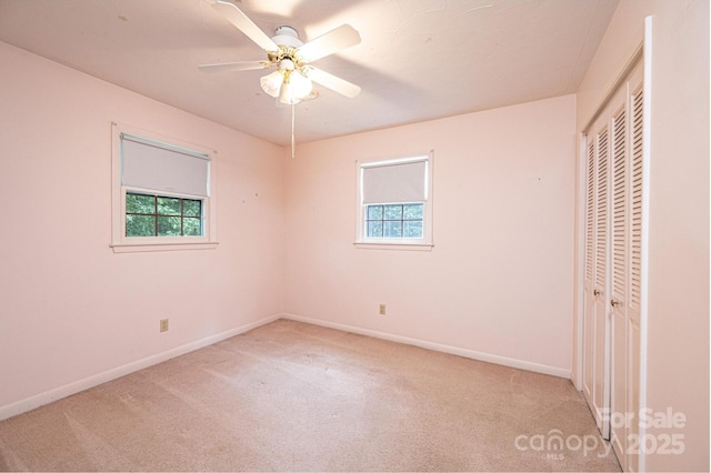 3781 Dover St, Claremont, NC 28610 - unfurnished bedroom with multiple windows, a closet, and light carpet