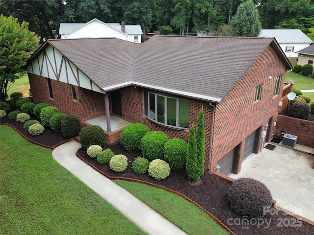 614 Azalea Ln, China Grove, NC 28023 - view of home's exterior featuring roof with shingles, an attached garage, brick siding, driveway, and a yard