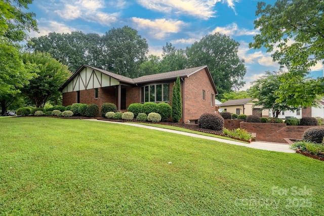 614 Azalea Ln, China Grove, NC 28023 - view of front facade featuring brick siding and a front lawn