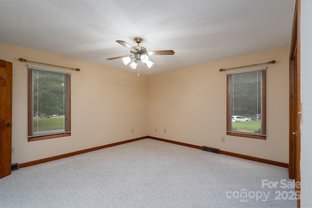 614 Azalea Ln, China Grove, NC 28023 - empty room with carpet flooring, a ceiling fan, and a textured ceiling