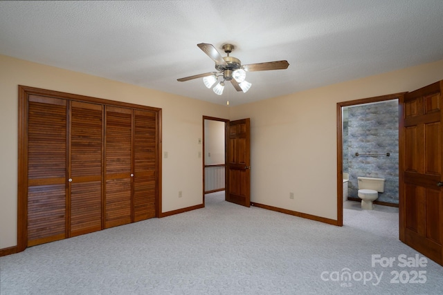 614 Azalea Ln, China Grove, NC 28023 - unfurnished bedroom with a closet, light colored carpet, connected bathroom, and ceiling fan