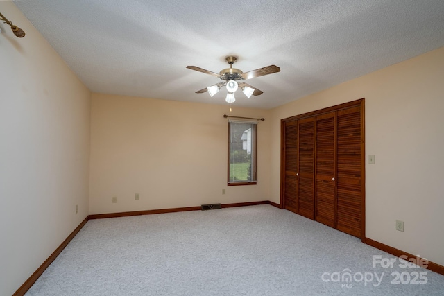 614 Azalea Ln, China Grove, NC 28023 - unfurnished bedroom with carpet floors, a closet, ceiling fan, and a textured ceiling