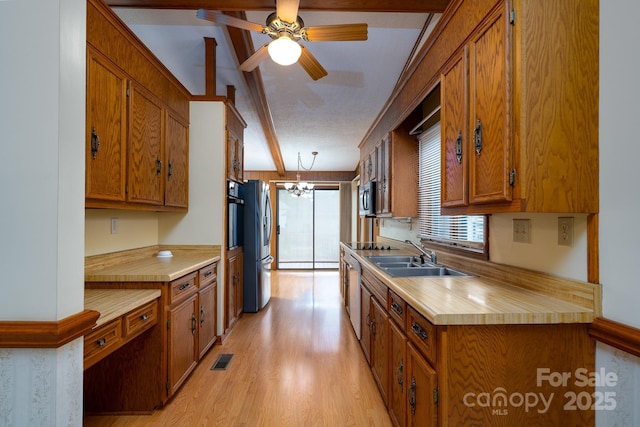 614 Azalea Ln, China Grove, NC 28023 - kitchen with brown cabinets, a chandelier, light wood finished floors, and light countertops
