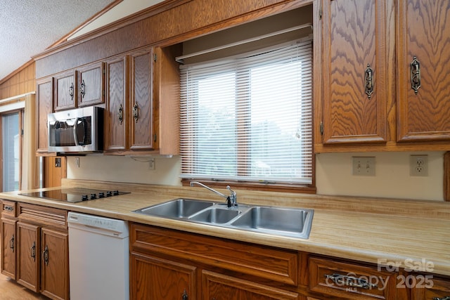 614 Azalea Ln, China Grove, NC 28023 - kitchen featuring white dishwasher, stainless steel microwave, vaulted ceiling, light countertops, and black electric cooktop