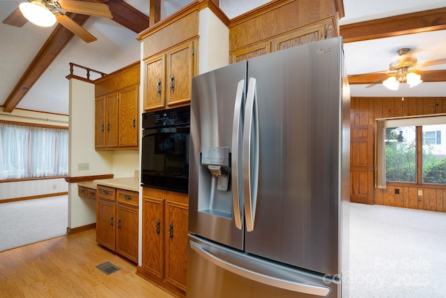 614 Azalea Ln, China Grove, NC 28023 - kitchen featuring stainless steel fridge with ice dispenser, a ceiling fan, black oven, beamed ceiling, and brown cabinets