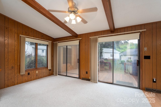 614 Azalea Ln, China Grove, NC 28023 - empty room with wooden walls, a ceiling fan, and carpet flooring
