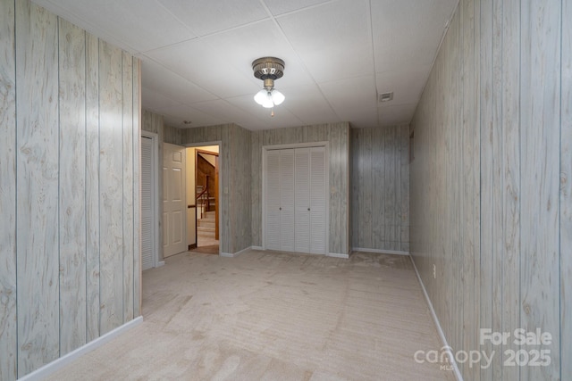 614 Azalea Ln, China Grove, NC 28023 - unfurnished bedroom featuring carpet flooring and wooden walls