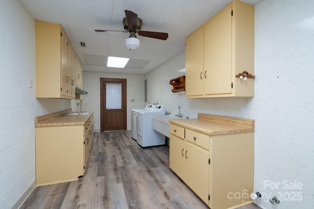 614 Azalea Ln, China Grove, NC 28023 - washroom with cabinet space, independent washer and dryer, light wood-type flooring, and a ceiling fan