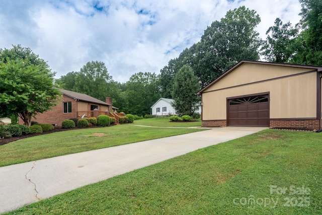 614 Azalea Ln, China Grove, NC 28023 - exterior space featuring brick siding, a front lawn, driveway, and a garage