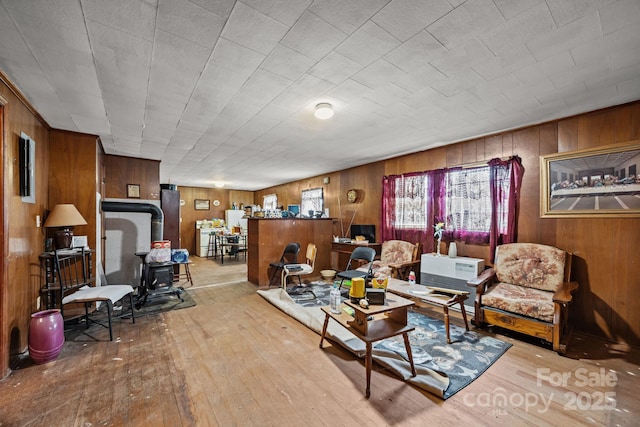 10 Manus Chapel Rd, Mill Spring, NC 28756 - living room featuring wood-type flooring, wood walls, and a wood stove