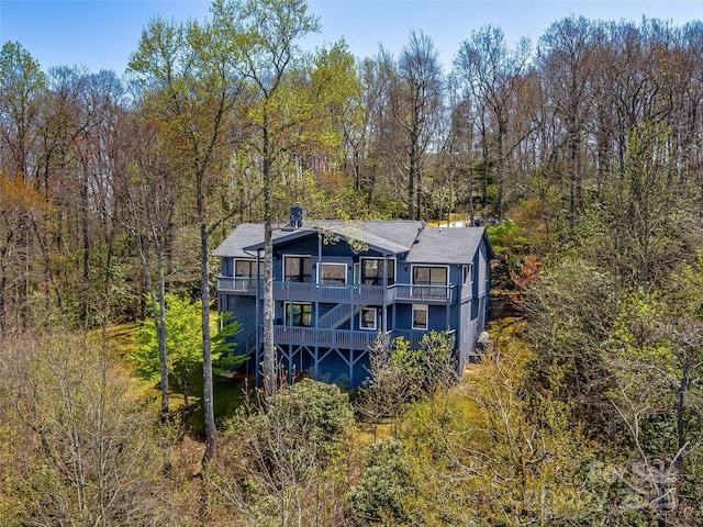 80 Raven Rock Vis, Lake Toxaway, NC 28747 - rear view of property featuring a deck, a balcony, and a wooded view