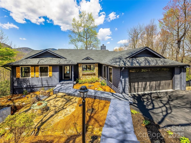 80 Raven Rock Vis, Lake Toxaway, NC 28747 - view of front of property with a chimney, a garage, driveway, and roof with shingles