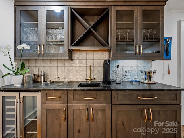 80 Raven Rock Vis, Lake Toxaway, NC 28747 - indoor wet bar featuring wine cooler and decorative backsplash