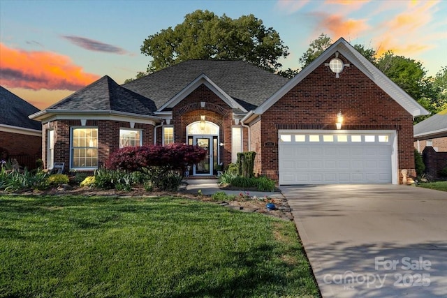 1511 Elkhart Cir, Gastonia, NC 28054 - view of front facade featuring concrete driveway, brick siding, a lawn, an attached garage, and roof with shingles