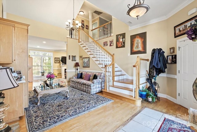 1511 Elkhart Cir, Gastonia, NC 28054 - entryway featuring stairway, crown molding, a chandelier, and wood finished floors