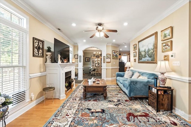 1511 Elkhart Cir, Gastonia, NC 28054 - living area featuring arched walkways, ceiling fan, recessed lighting, light wood-style flooring, and a fireplace