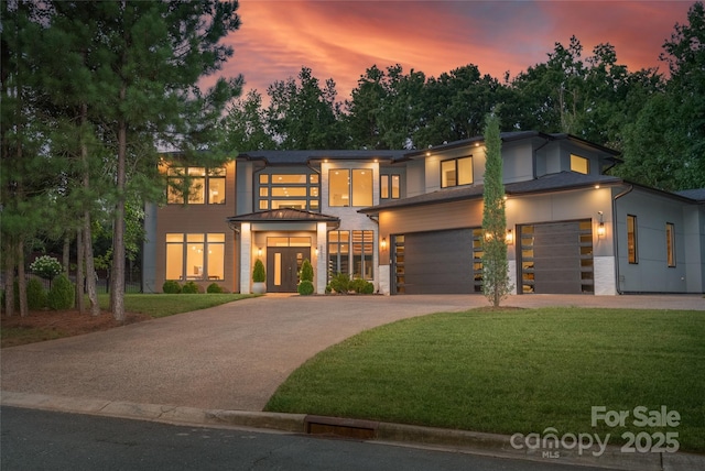 8403 Sarsfield Ct, Waxhaw, NC 28173 - view of front of property featuring concrete driveway, a yard, stucco siding, and french doors