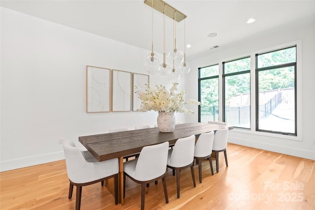 8403 Sarsfield Ct, Waxhaw, NC 28173 - dining room with light wood-type flooring, recessed lighting, and a chandelier