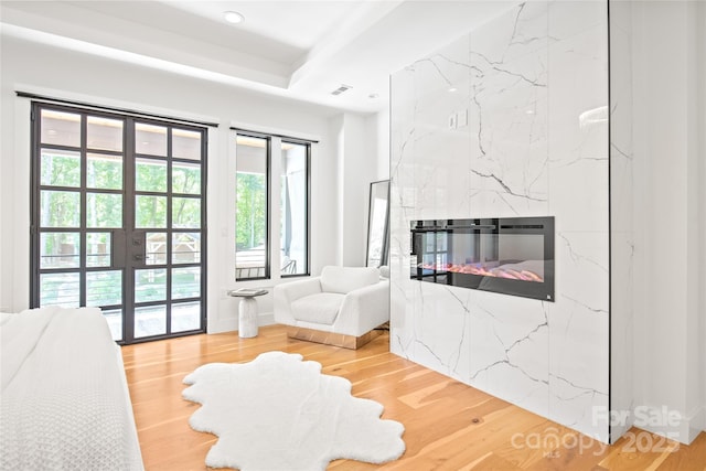 8403 Sarsfield Ct, Waxhaw, NC 28173 - living room with french doors, wood finished floors, a fireplace, and recessed lighting