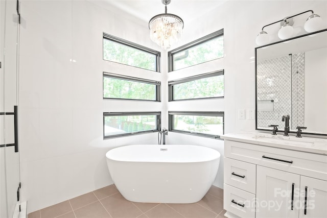 8403 Sarsfield Ct, Waxhaw, NC 28173 - bathroom with a freestanding tub, plenty of natural light, and tile patterned flooring