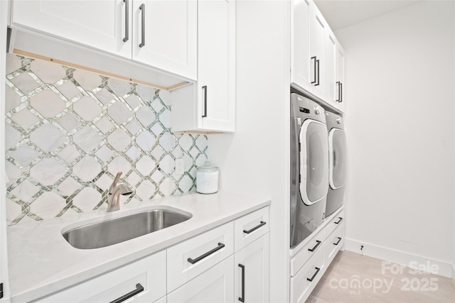 8403 Sarsfield Ct, Waxhaw, NC 28173 - washroom with cabinet space, washer and clothes dryer, and light tile patterned flooring