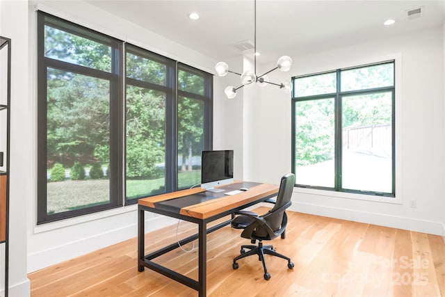 8403 Sarsfield Ct, Waxhaw, NC 28173 - office space with healthy amount of natural light, a chandelier, light wood finished floors, and recessed lighting