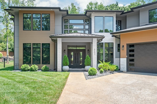 8403 Sarsfield Ct, Waxhaw, NC 28173 - entrance to property featuring french doors, a standing seam roof, concrete driveway, and a metal roof