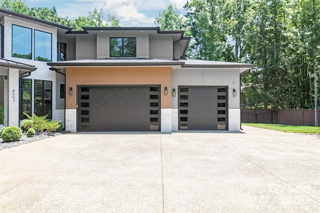 8403 Sarsfield Ct, Waxhaw, NC 28173 - view of front of home with concrete driveway, an attached garage, and stone siding