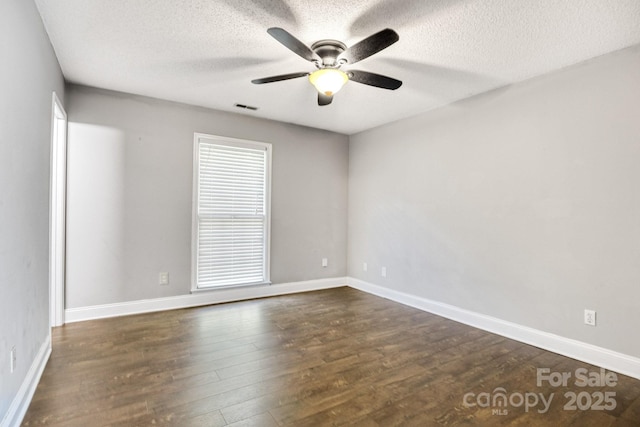1012 Thorncrest Dr, Fletcher, NC 28732 - spare room featuring dark wood-style floors, ceiling fan, and a textured ceiling