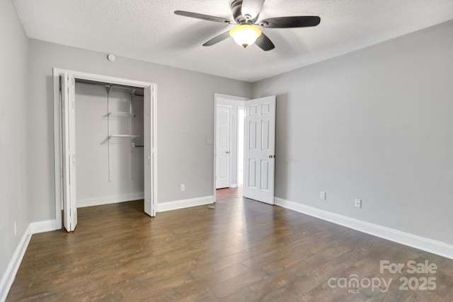 1012 Thorncrest Dr, Fletcher, NC 28732 - unfurnished bedroom featuring wood finished floors, a textured ceiling, a closet, and a ceiling fan