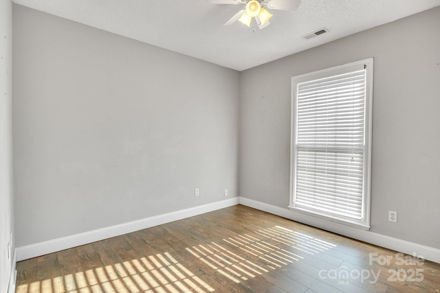 1012 Thorncrest Dr, Fletcher, NC 28732 - unfurnished room with hardwood / wood-style floors, ceiling fan, and plenty of natural light