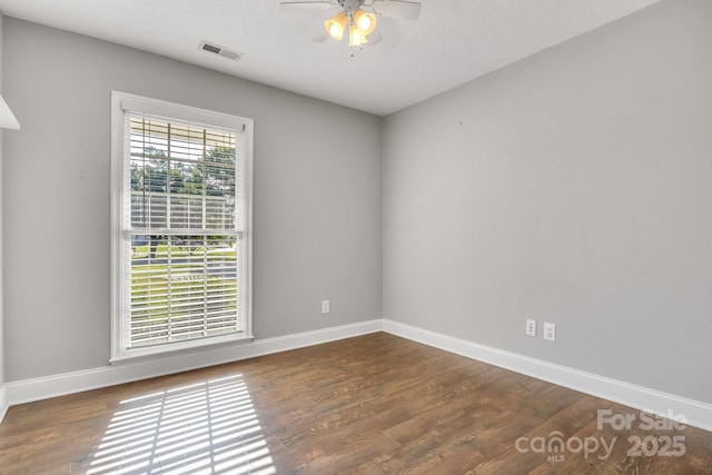 1012 Thorncrest Dr, Fletcher, NC 28732 - empty room featuring a ceiling fan, wood finished floors, and a textured ceiling