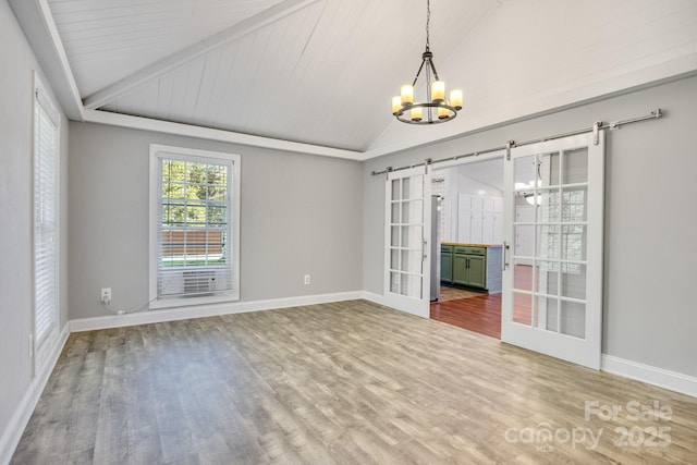 1012 Thorncrest Dr, Fletcher, NC 28732 - unfurnished room featuring a barn door, lofted ceiling, a chandelier, wood finished floors, and wooden ceiling