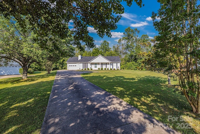 1012 Thorncrest Dr, Fletcher, NC 28732 - ranch-style home featuring concrete driveway, a front lawn, an attached garage, and a chimney