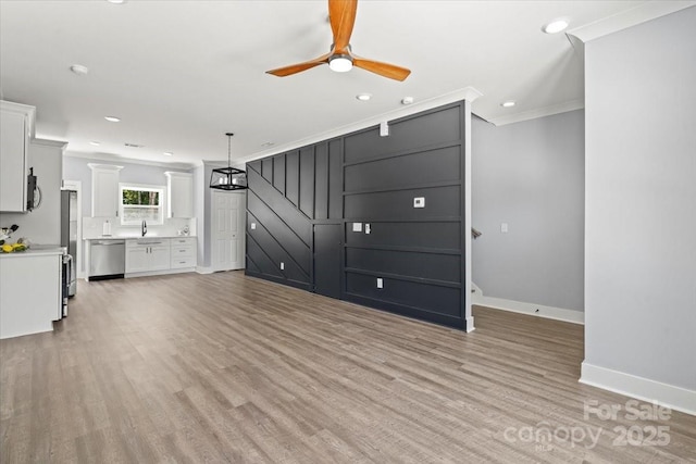 100 Boyette Dr Unit A, Albemarle, NC 28001 - unfurnished living room featuring crown molding, a ceiling fan, light wood-style floors, and recessed lighting