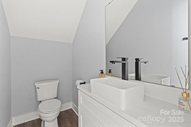 100 Boyette Dr Unit A, Albemarle, NC 28001 - bathroom with wood finished floors, vanity, and lofted ceiling