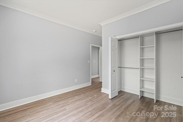 100 Boyette Dr Unit A, Albemarle, NC 28001 - unfurnished bedroom with wood finished floors, ornamental molding, and a closet