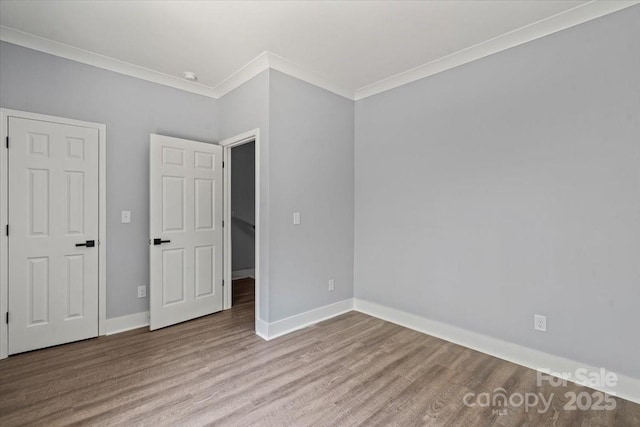 100 Boyette Dr Unit A, Albemarle, NC 28001 - unfurnished bedroom featuring ornamental molding and wood finished floors