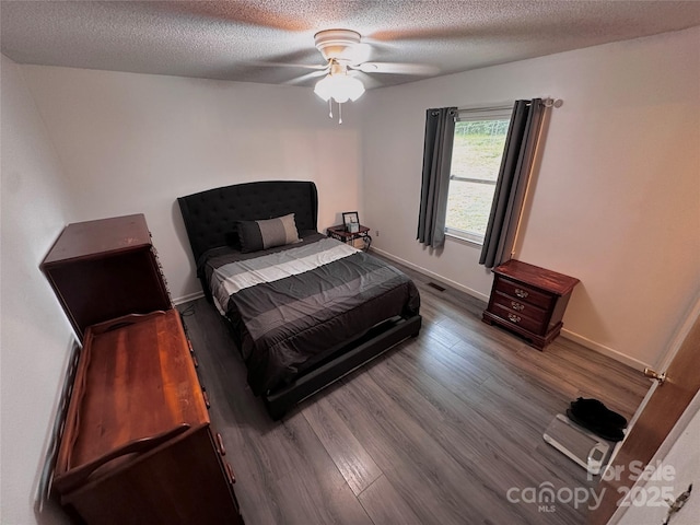 313 Willow St, Stanley, NC 28164 - bedroom featuring wood finished floors, ceiling fan, and a textured ceiling