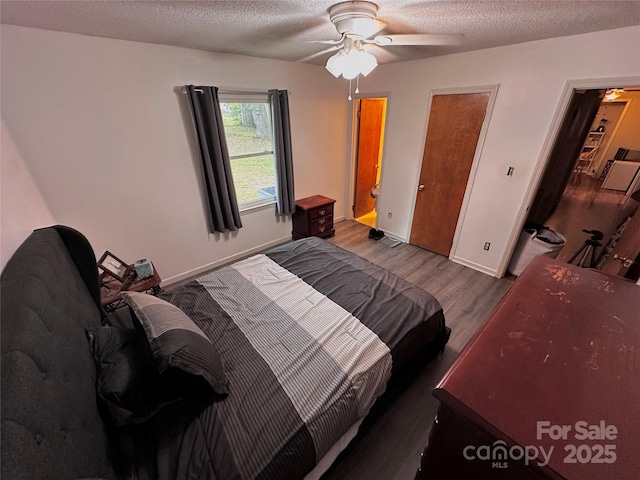 313 Willow St, Stanley, NC 28164 - bedroom featuring wood finished floors, a textured ceiling, and ceiling fan