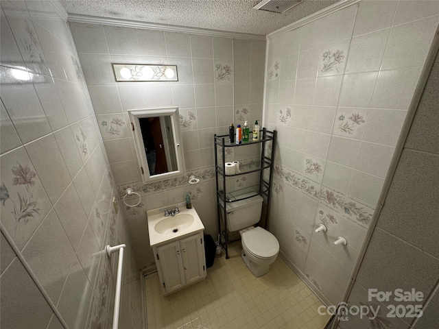 313 Willow St, Stanley, NC 28164 - half bath with ornamental molding, a textured ceiling, vanity, and tile patterned floors