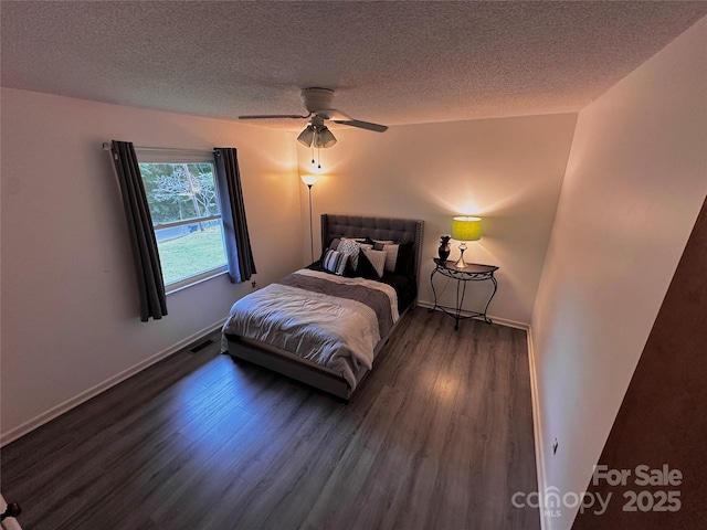313 Willow St, Stanley, NC 28164 - bedroom featuring wood finished floors, a textured ceiling, and ceiling fan