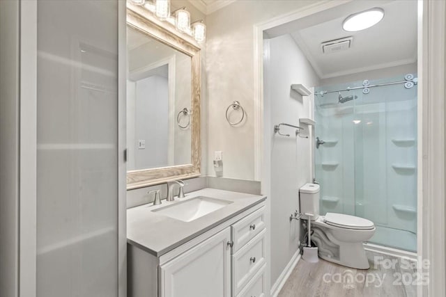 6500 Peacehaven Dr, Charlotte, NC 28214 - full bathroom featuring ornamental molding, a stall shower, vanity, and wood finished floors