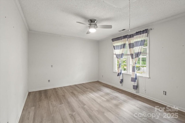 6500 Peacehaven Dr, Charlotte, NC 28214 - spare room featuring a textured ceiling, crown molding, wood finished floors, and a ceiling fan