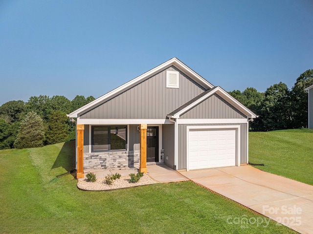 815 32nd St NE Unit 3, Conover, NC 28613 - view of front facade featuring an attached garage, a front yard, concrete driveway, and stone siding