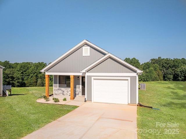 815 32nd St NE Unit 3, Conover, NC 28613 - view of front of home featuring concrete driveway, a front lawn, an attached garage, a porch, and a forest view