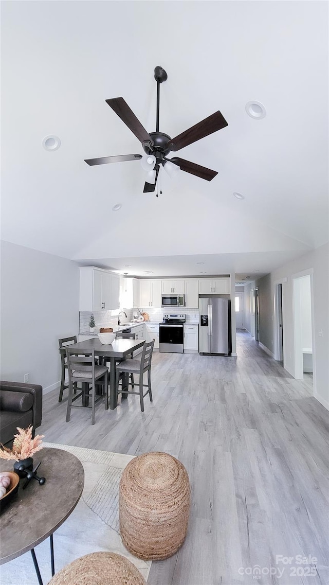 815 32nd St NE Unit 3, Conover, NC 28613 - dining area with light wood-style floors, lofted ceiling, ceiling fan, and recessed lighting