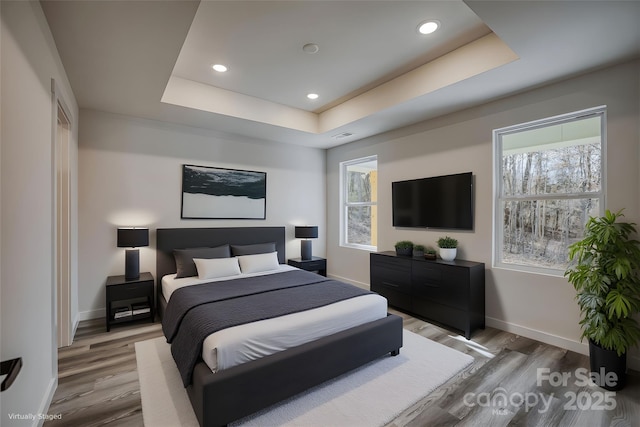 815 32nd St NE Unit 3, Conover, NC 28613 - bedroom featuring light wood-style floors, a raised ceiling, and recessed lighting